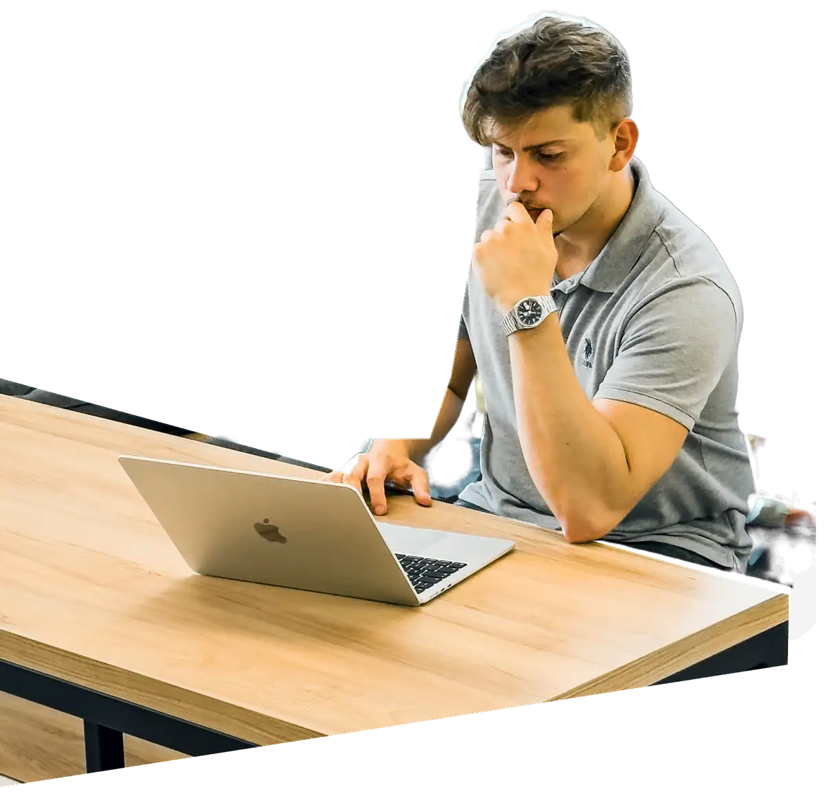 Tudor Costin at his desk, working through a problem on his laptop